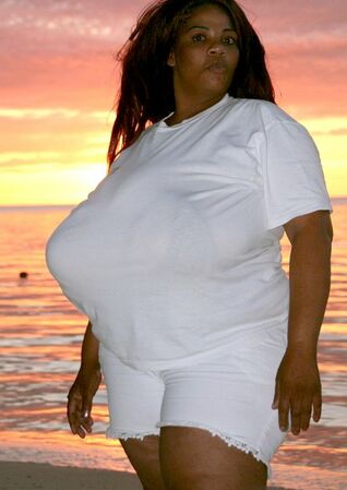 Plumper dark-hued mama with fat