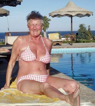 Chesty mature femmes sunbathing..