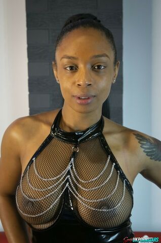 Black model Alicia Rhodes poses in